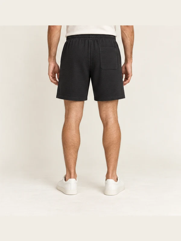 Cinder Texture Shorts — Washed Black, On-model back view